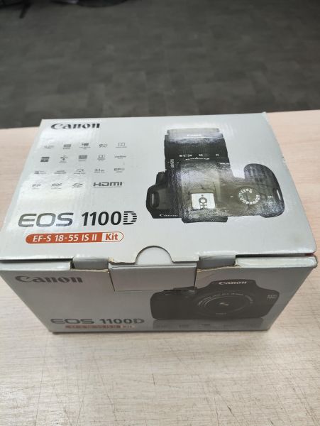 Купить Canon EOS 1100D (DS126291) Kit с СЗУ в Томск за 5599 руб.