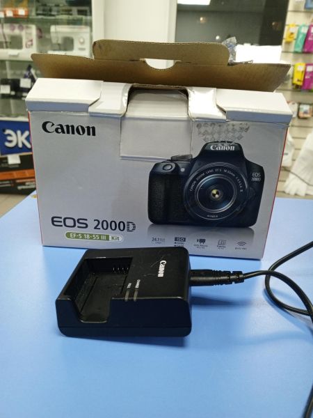 Купить Canon EOS 2000D (DS126741) kit с СЗУ в Усть-Илимск за 16300 руб.